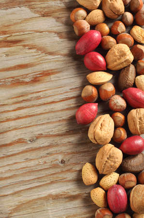 Assortment of tasty nuts on wooden backgroundの写真素材
