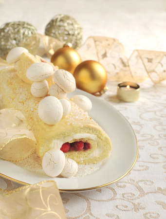 Traditional Christmas Yule Log cake decorated with meringue mushrooms の写真素材