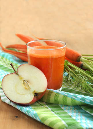 Glass of apple and carrot juice の写真素材