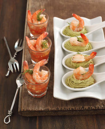Tomato salsa with shrimp and Avocado cream and shrimp in spoon の写真素材
