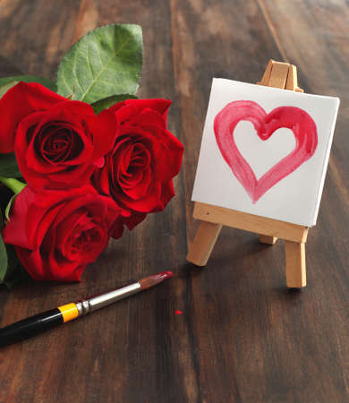 Bouquet of roses and painted heart の写真素材