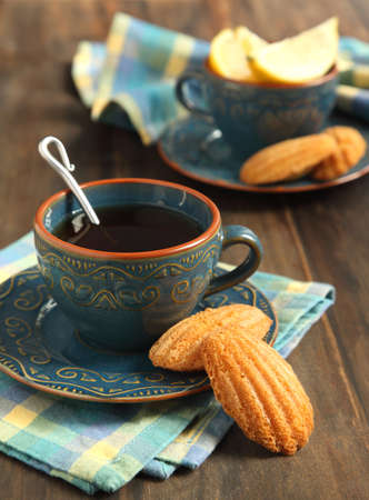 Lemon Madeleine and cup of tea の写真素材