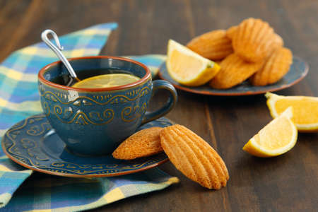 Lemon Madeleine and cup of tea の写真素材
