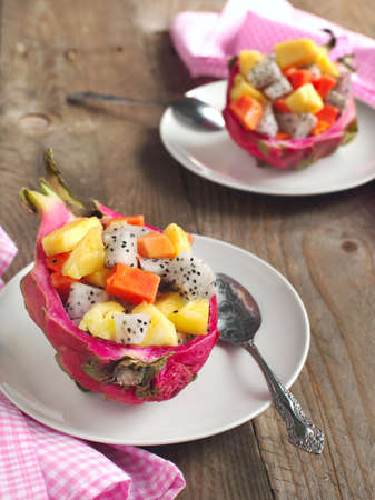 Fresh fruit salad in dragon fruit skinの写真素材