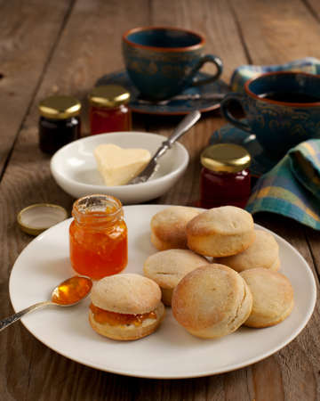 Home-baked scones tea with jam and butterの写真素材