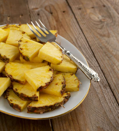 Pineapple slices on plateの写真素材