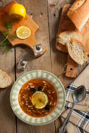 Solyanka, Russian soup with meat, sausage, olives and picklesの写真素材