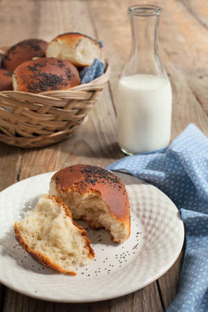 Buns with poppy seeds and milkの写真素材