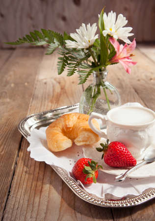 Breakfast with coffee and fresh croissants for mommyの写真素材