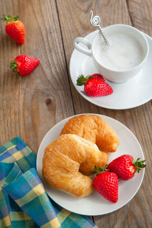 Breakfast with coffee and fresh croissantsの写真素材