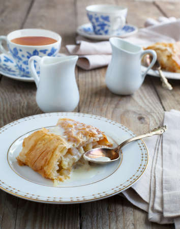Apple strudel with vanilla cream sause  Selective focusの写真素材