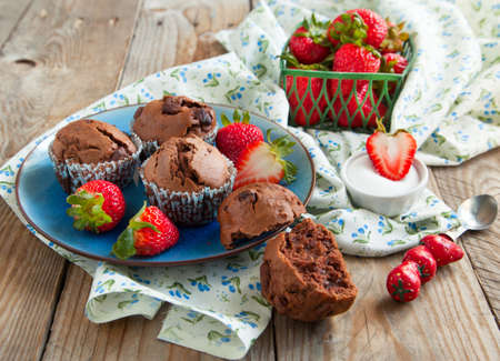 Chocolate muffins and strawberriesの写真素材