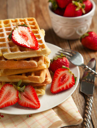 Waffles with strawberries for breakfastの写真素材