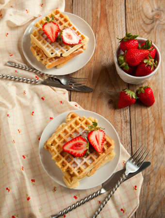 Waffles with strawberries for breakfastの写真素材