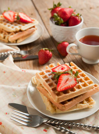 Waffles with strawberries for breakfastの写真素材