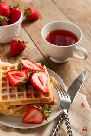 Waffles with strawberries for breakfastの写真素材