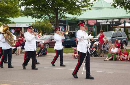 AURORA, ONTARIO, CANADA- JULY 1: Marching band of The Governor General\'s Horse Guards during the Canada Day Parade at part of Young Street in Aurora, Canada on July 1, 2013のeditorial素材