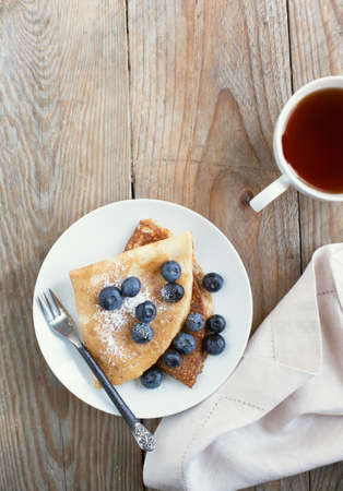 Crepes with blueberries and sugar powderの写真素材