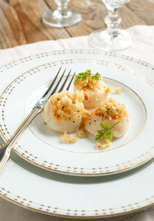 Baked scallops with herbal crumblsの写真素材