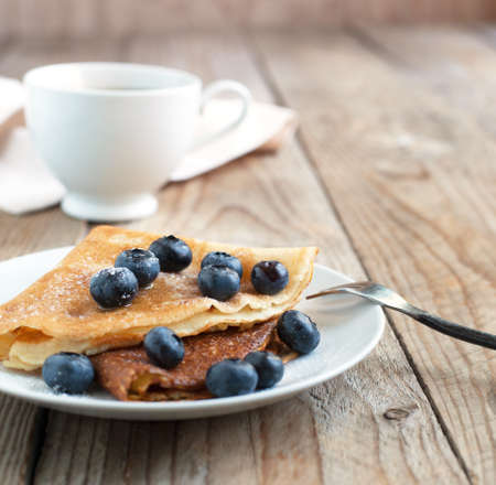 Crepes with blueberries and sugar powderの写真素材