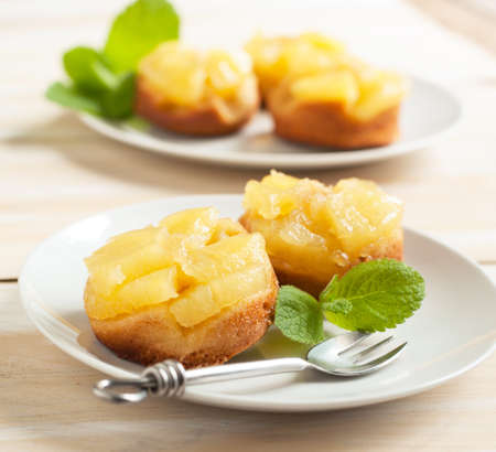 Individual pineapple upside-down cakesの写真素材