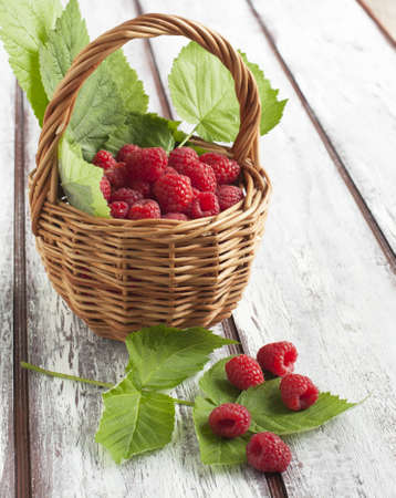 Fresh raspberries in basketの写真素材