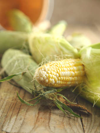Fresh corn on wooden backgroundの写真素材