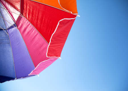 Colorful Beach Umbrella against the Skyの写真素材