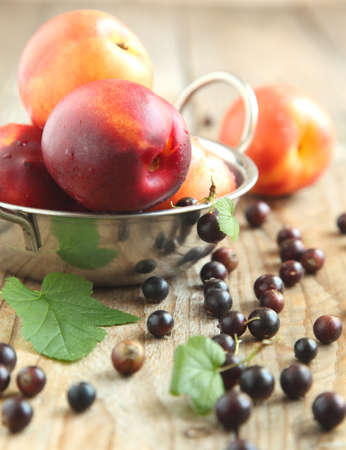 Nectarines and black currant  Selective focusの写真素材