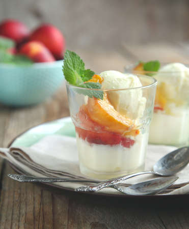 Vanilla ice cream with caramelized peachesの写真素材