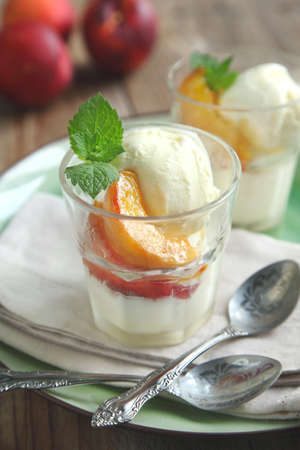 Vanilla ice cream with caramelized peachesの写真素材