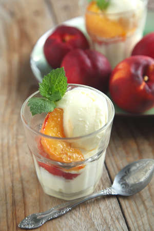 Vanilla ice cream with caramelized peachesの写真素材