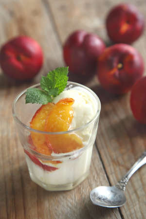 Vanilla ice cream with caramelized peachesの写真素材