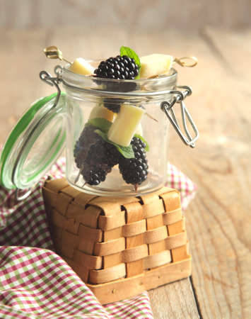 Fruits, cheese and herb skewersの写真素材