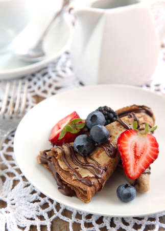 Chocolate crepes with fresh berriesの写真素材