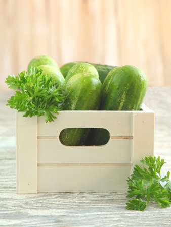 Fresh cucumbers in wooden boxの写真素材