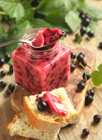Blackcurrant jam  Selective focus on spoon with jamの写真素材