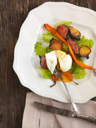 Roasted-vegetable salad with poached eggsの写真素材