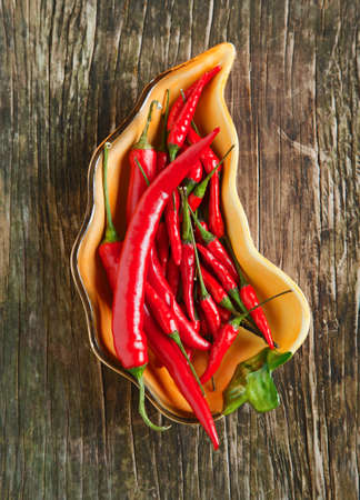 Chili peppers in bowlの写真素材