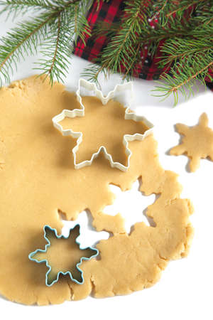 Cutting gingerbread cookies dough homemade for Christmasの写真素材
