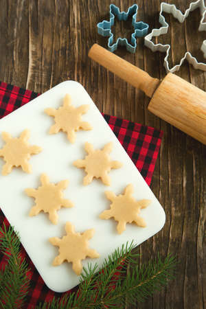 Cutting gingerbread cookies dough homemade for Christmasの写真素材