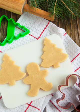 Cutting gingerbread cookies dough homemade for Christmas  Selective focusの写真素材