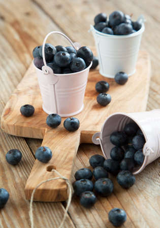 Fresh blueberries in small bucket  Selective focusの写真素材