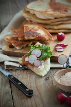 Homemade milk flatbread with cream cheese, lettuce and radishの写真素材