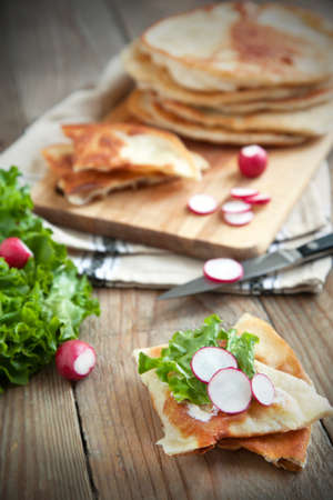 Homemade milk flatbread with cream cheese, lettuce and radishの写真素材