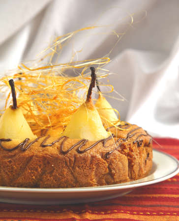   1057;ake with pears with spun sugar strands