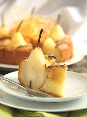 Piece of cake with pears with spun sugar strands  Selective focusの写真素材