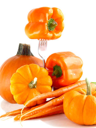 Fresh orange vegetables on a white background の写真素材