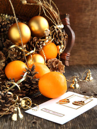 Christmas Card with Christmas decoration, oranges and pine conesの写真素材
