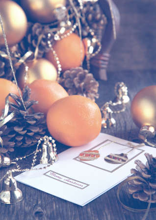 Christmas Card with Christmas decoration, oranges and pine conesの写真素材